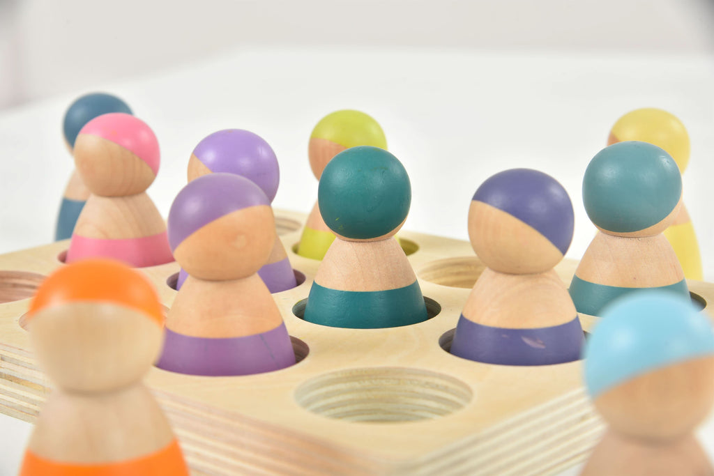 Avenlur rainbow peg dolls in a small world play scene