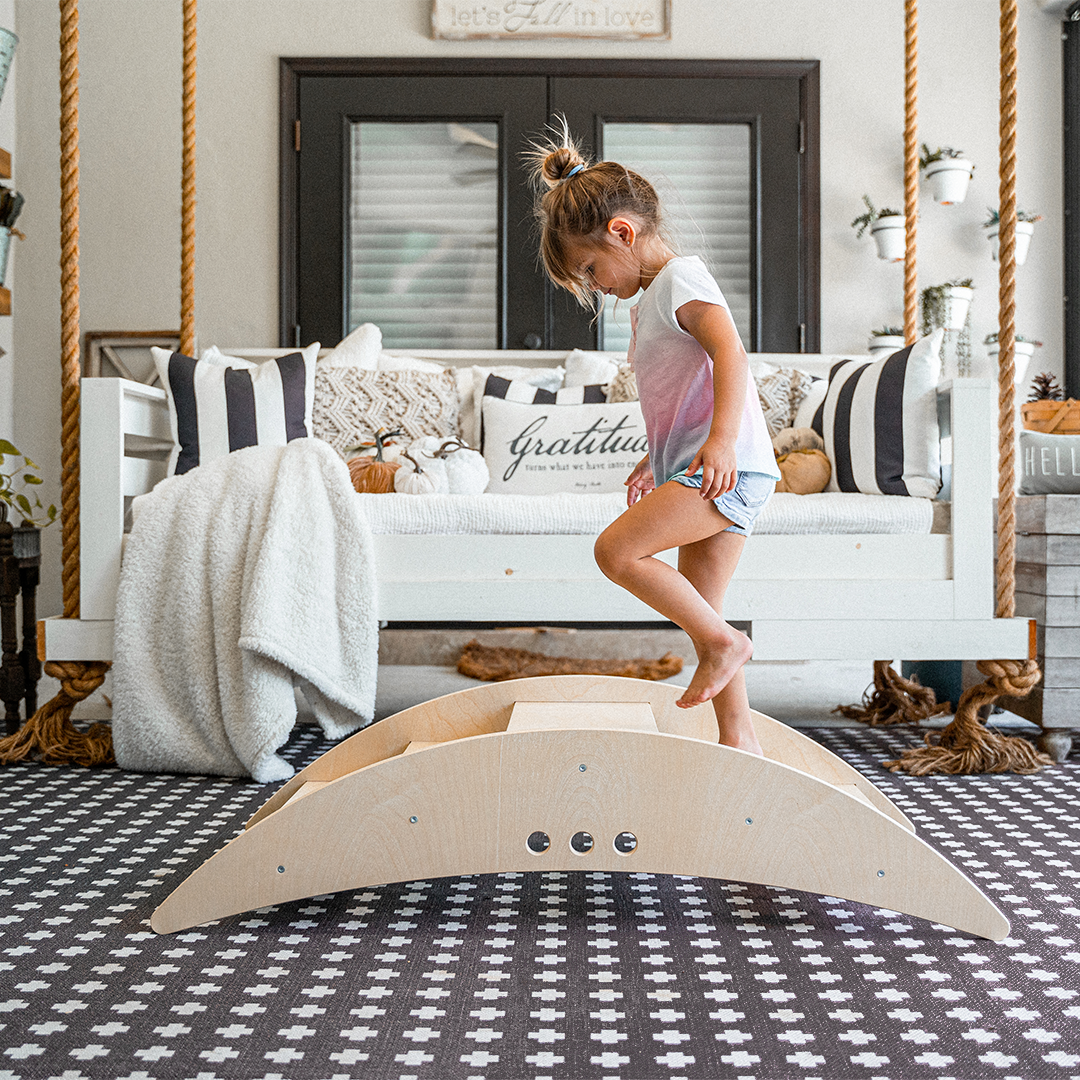 Young girl crossing the Avenlur Rowan flipped into stepped climbing-bridge mode