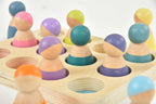 Avenlur wooden peg dolls shown at hand size