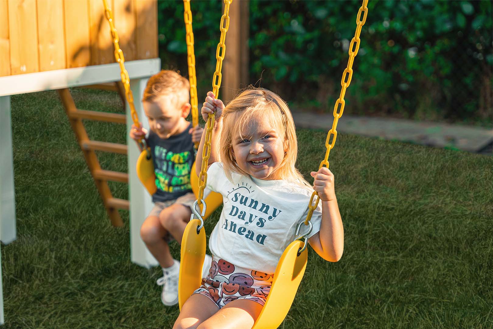 Smiling Girl on Avenlur's Forrest Wooden Swing Set