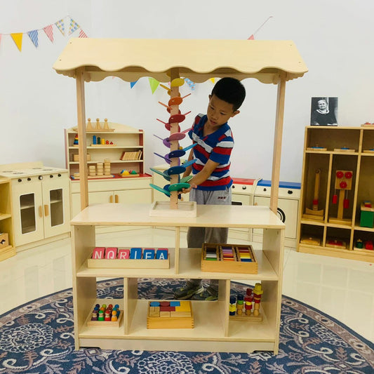 Child Playing with Sequoia - Avenlur's Market Stand for Pretend Play Made From Natural Wood